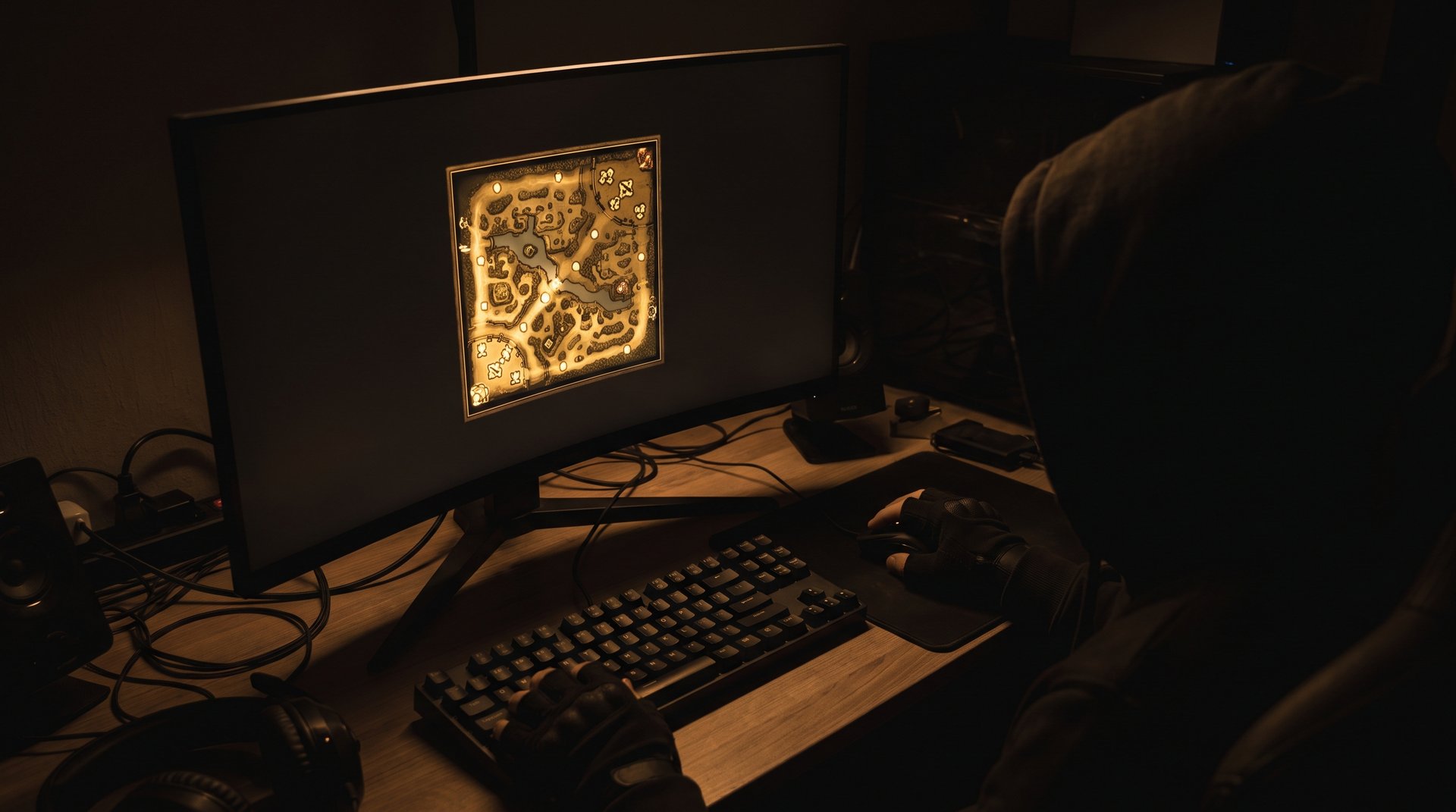 Dota 2 player studying gameplay footage on gaming monitor